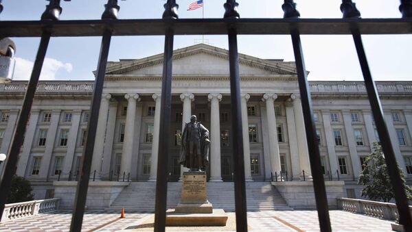 In this Monday, Aug. 8, 2011, file photo, a statue of former Treasury Secretary Albert Gallatin stands guard outside the Treasury Building in Washington - Sputnik International