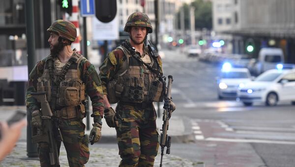 In this image taken from video, police cars create a cordon near the train station in central Brussels, Tuesday June 20, 2017. Belgian media report that explosion-like noises have been heard at a Brussels train station; the main square evacuated. - Sputnik International