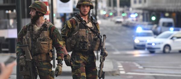 In this image taken from video, police cars create a cordon near the train station in central Brussels, Tuesday June 20, 2017. Belgian media report that explosion-like noises have been heard at a Brussels train station; the main square evacuated. In this image taken from video, police cars create a cordon near the train station in central Brussels, Tuesday June 20, 2017. Belgian media report that explosion-like noises have been heard at a Brussels train station; the main square evacuated. - Sputnik International