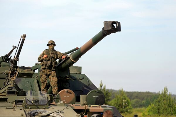 A Polish Army soldier attends the 2017 Iron Wolf exercise in Stasenai, Lithuania, June 20, 2017 A Polish Army soldier attends the 2017 Iron Wolf exercise in Stasenai, Lithuania, June 20, 2017 - Sputnik International