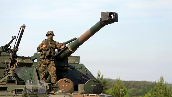 A Polish Army soldier attends the 2017 Iron Wolf exercise in Stasenai, Lithuania, June 20, 2017 - Sputnik International