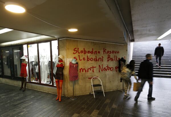People pass through an underground passage with graffiti on the wall that reads: Free Kosovo, Free Balkan, Death for NATO, in Belgrade, Serbia (File) People pass through an underground passage with graffiti on the wall that reads: Free Kosovo, Free Balkan, Death for NATO, in Belgrade, Serbia (File) - Sputnik International