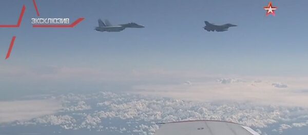 NATO's F-16 fighter being driven away from the Russian defense minister's plane in the Baltic airspace by a Su-27 jet. NATO's F-16 fighter being driven away from the Russian defense minister's plane in the Baltic airspace by a Su-27 jet. - Sputnik International