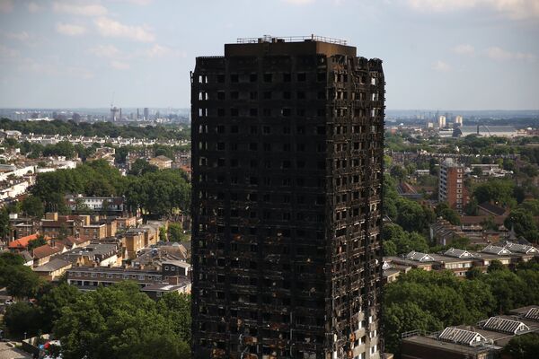 The burnt out remains of the Grenfell apartment tower are seen in North Kensington, London, Britain, June 18, 2017.  - Sputnik International