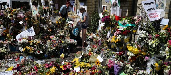 Floral tributes for the victims of the Grenfell Tower fire are left outside the Notting Hill Methodist Church, in London, Britain June 20, 2017. Floral tributes for the victims of the Grenfell Tower fire are left outside the Notting Hill Methodist Church, in London, Britain June 20, 2017. - Sputnik International