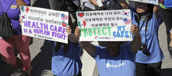Hundreds of people march through downtown Los Angeles protesting President Donald Trump's plan to dismantle the Affordable Care Act, his predecessor's signature health care law, Thursday, March 23, 2017 Hundreds of people march through downtown Los Angeles protesting President Donald Trump's plan to dismantle the Affordable Care Act, his predecessor's signature health care law, Thursday, March 23, 2017 - Sputnik International