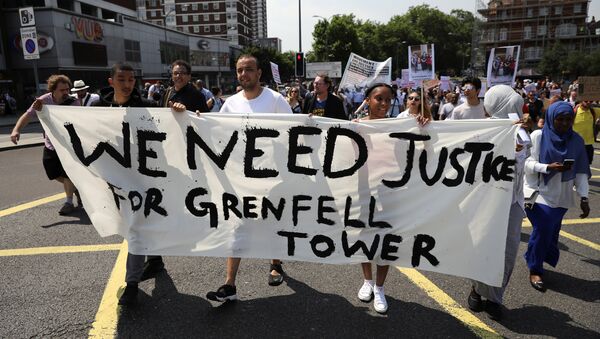 Demonstrators march during a protest about the Grenfell Tower fire, in London, Britain, June 21, 2017 - Sputnik International