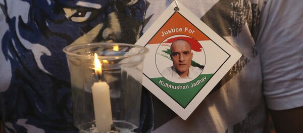An Indian man holds a candle as he participates in a demonstration in support of Indian naval officer Kulbhushan Jadhav in Mumbai, India, Saturday, June 03, 2017 An Indian man holds a candle as he participates in a demonstration in support of Indian naval officer Kulbhushan Jadhav in Mumbai, India, Saturday, June 03, 2017 - Sputnik International