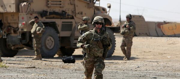 A U.S. soldier runs at a coalition forces forward base near West Mosul, Iraq June 21, 2017, where Iraqi security forces are fighting Islamic State A U.S. soldier runs at a coalition forces forward base near West Mosul, Iraq June 21, 2017, where Iraqi security forces are fighting Islamic State - Sputnik International