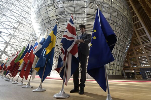 An organiser adjusts the British national flag on April 29, 2017, prior to the EU leaders summit at the Europa building, the main headquarters of European Council and the Council of the EU, in Brussels An organiser adjusts the British national flag on April 29, 2017, prior to the EU leaders summit at the Europa building, the main headquarters of European Council and the Council of the EU, in Brussels - Sputnik International