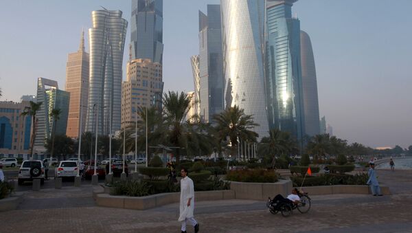 A man walks on the corniche in Doha, Qatar, June 15, 2017 - Sputnik International