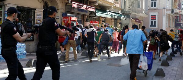 Riot police use rubber pellets to disperse LGBT rights activists as they try to gather for a pride parade, which was banned by the governorship, in central Istanbul, Turkey Riot police use rubber pellets to disperse LGBT rights activists as they try to gather for a pride parade, which was banned by the governorship, in central Istanbul, Turkey - Sputnik International