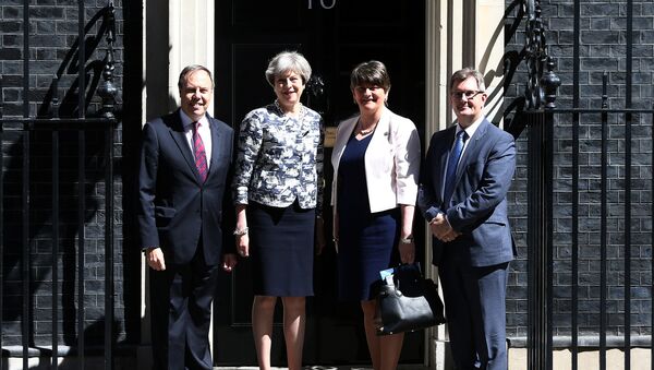 Britain's Prime Minister, Theresa May, poses for a photograph with Democratic Unionist Party (DUP) Leader Arlene Foster, Deputy Leader Nigel Dodds, and Chief Whip Jeffrey Donaldson, outside 10 Downing Street, in central London, Britain June 26, 2017. - Sputnik International