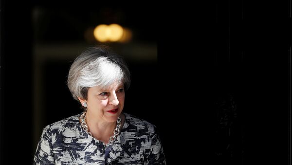Britain's Prime Minister, Theresa May, waits to greet Democratic Unionist Party (DUP) Leader Arlene Foster, in Downing Street, in central London, Britain June 26, 2017. - Sputnik International