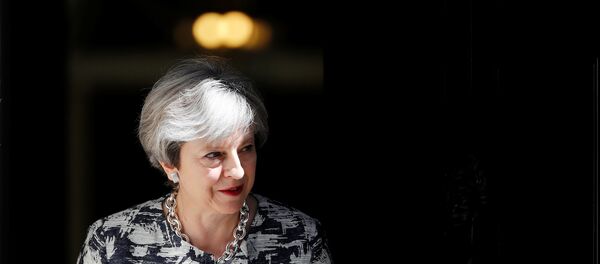 Britain's Prime Minister, Theresa May, waits to greet Democratic Unionist Party (DUP) Leader Arlene Foster, in Downing Street, in central London, Britain June 26, 2017. - Sputnik International