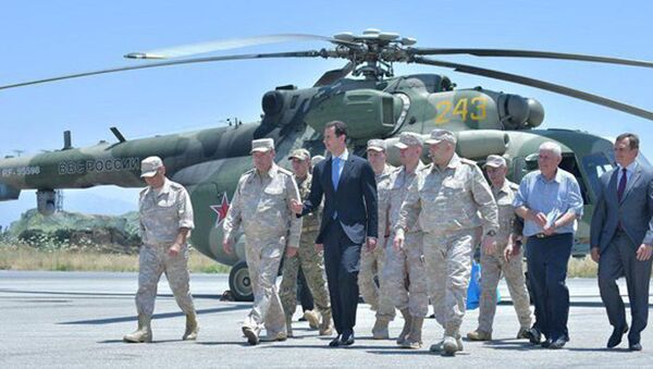 Syria's President Bashar al-Assad visits a Russian air base at Hmeymim, in western Syria in this handout picture posted on SANA on June 27, 2017, Syria. - Sputnik International