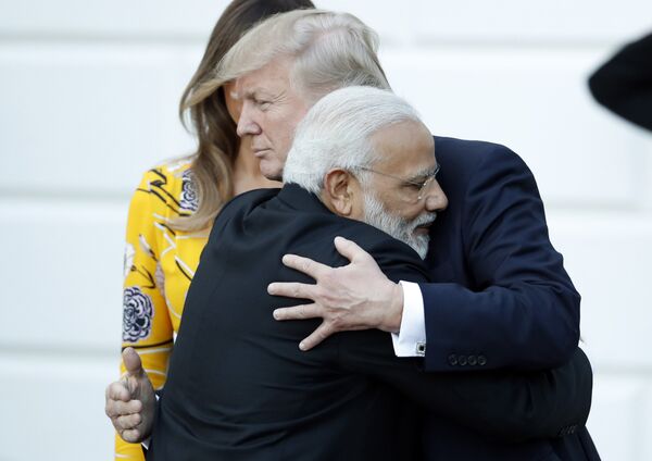 Indian Prime Minister Narendra Modi hugs President Donald Trump as Modi departs the White House, Monday, June 26, 2017, in Washington. - Sputnik International
