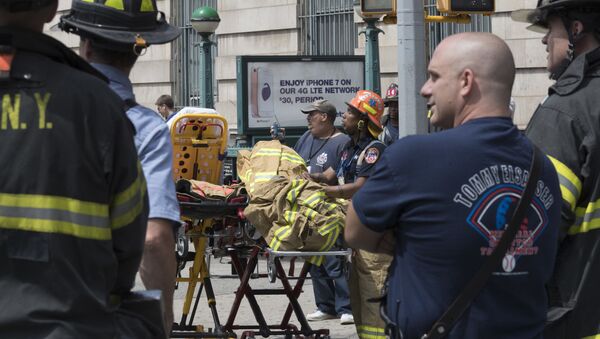 Emergency service personnel work at the scene of a subway train derailment, Tuesday, June 27, 2017, in the Harlem neighborhood of New York - Sputnik International