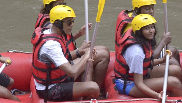 Former U.S. President Barack Obama, left, his wife Michelle, rear left, and daughter Sasha, right, raft on the Ayung River in Badung, on Bali island, Indonesia, Monday, June 26, 2017. - Sputnik International