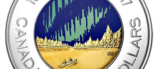 A glow-in-the-dark coin depicting the Aurora Borealis, minted by the Royal Canadian Mint to celebrate the nation's 150th anniversary A glow-in-the-dark coin depicting the Aurora Borealis, minted by the Royal Canadian Mint to celebrate the nation's 150th anniversary - Sputnik International