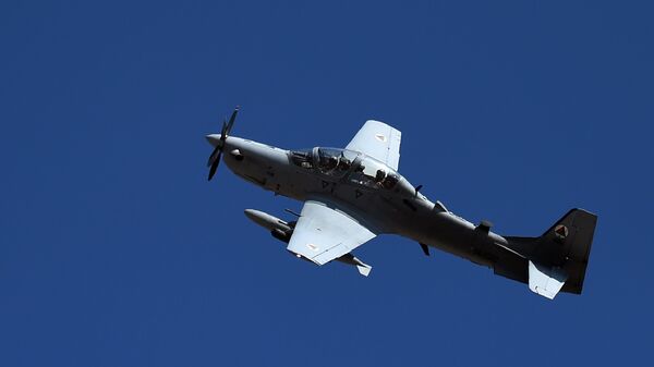 In this photograph taken on October 18, 2016, an Afghan Air Force Embraer A-29 Super Tucano aircraft flies during an airstrike training mission on the outskirts of Logar province - Sputnik International