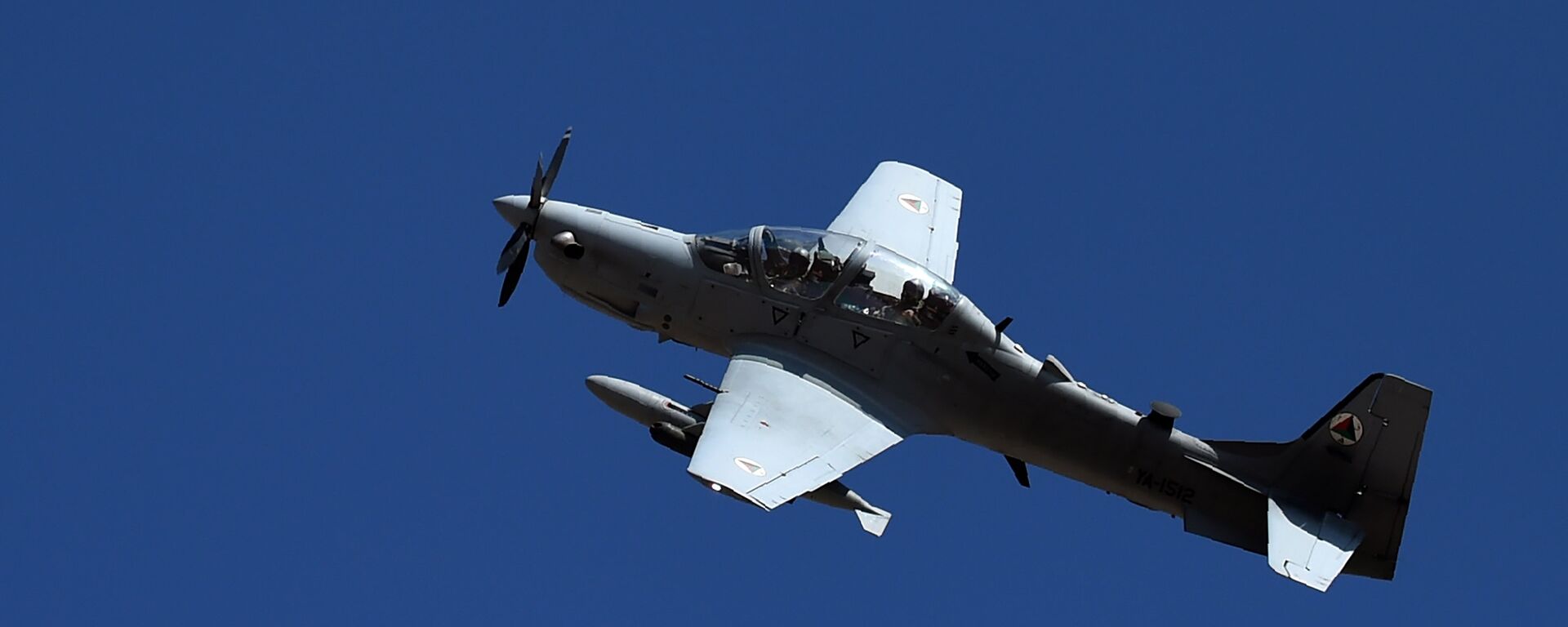 In this photograph taken on October 18, 2016, an Afghan Air Force Embraer A-29 Super Tucano aircraft flies during an airstrike training mission on the outskirts of Logar province - Sputnik International, 1920