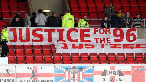 Liverpool fans place a banner about the Hillsborough justice campaign ahead of the English Premier League soccer match between Sunderland and Liverpool at the Stadium of Light, Sunderland, England, Saturday, Sept. 15, 2012. - Sputnik International