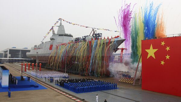In this photo released by Xinhua News Agency, fireworks explode next to China's new domestically-built 10,000-ton Type 055 destroyer during a launching ceremony at Jiangnan Shipyard in Shanghai, China, Wednesday, June 28, 2017 - Sputnik International