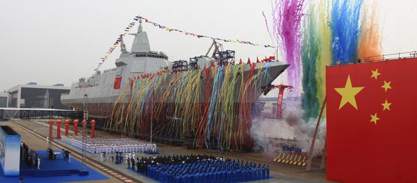 In this photo released by Xinhua News Agency, fireworks explode next to China's new domestically-built 10,000-ton Type 055 destroyer during a launching ceremony at Jiangnan Shipyard in Shanghai, China, Wednesday, June 28, 2017 In this photo released by Xinhua News Agency, fireworks explode next to China's new domestically-built 10,000-ton Type 055 destroyer during a launching ceremony at Jiangnan Shipyard in Shanghai, China, Wednesday, June 28, 2017 - Sputnik International