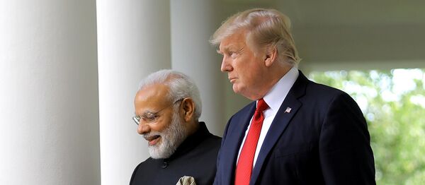 U.S. President Donald Trump (R) arrives for a joint news conference with Indian Prime Minister Narendra Modi (L) in the Rose Garden of the White House in Washington, U.S., June 26, 2017 - Sputnik International