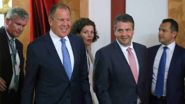 Foreground, from left: Russian Foreign Minister Sergei Lavrov and German Foreign Minister Sigmar Gabriel at the news conference in Krasnodar - Sputnik International
