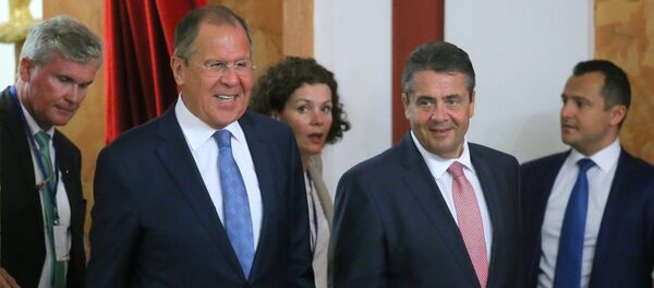 Foreground, from left: Russian Foreign Minister Sergei Lavrov and German Foreign Minister Sigmar Gabriel at the news conference in Krasnodar - Sputnik International