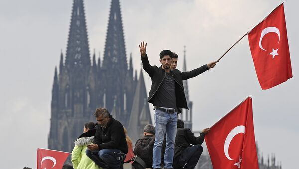 Turkish protesters demonstrate in Cologne, Germany, Sunday, July 31, 2016. Thousands of supporters of Turkish President Recep Tayyip Erdogan have gathered in the German city of Cologne for a demonstration against the failed July 15 coup in Turkey. - Sputnik International