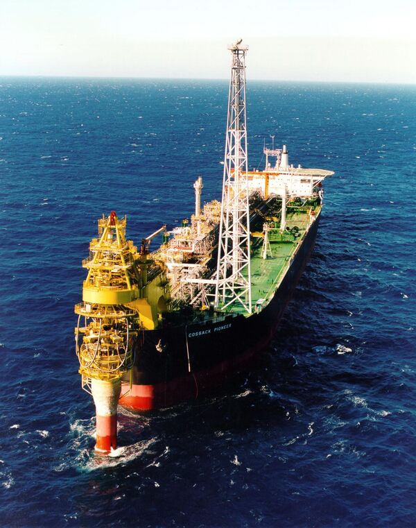 An undated handout photo shows Australian resources giant Woodside's Cossack Pioneer oil production facility in the North West Shelf (NWS) gas project, which produces a third of Australia's oil and half of its natural gas, off the northwest coast of Australia (File) An undated handout photo shows Australian resources giant Woodside's Cossack Pioneer oil production facility in the North West Shelf (NWS) gas project, which produces a third of Australia's oil and half of its natural gas, off the northwest coast of Australia (File) - Sputnik International