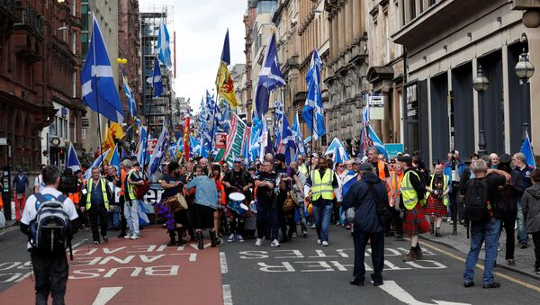 Demonstrators carry Scottish flags at a march in support of Scottish independence, in Glasgow, Scotland, Britain June 3, 2017 - Sputnik International