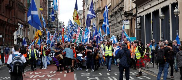 Demonstrators carry Scottish flags at a march in support of Scottish independence, in Glasgow, Scotland, Britain June 3, 2017 - Sputnik International