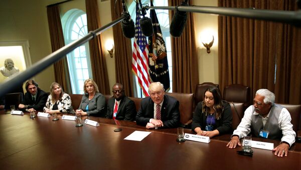 U.S. President Donald Trump (C) meets with immigration crime victims at the White House in Washington, U.S., June 28, 2017 - Sputnik International