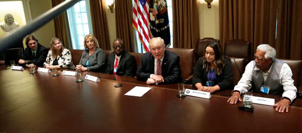 U.S. President Donald Trump (C) meets with immigration crime victims at the White House in Washington, U.S., June 28, 2017 - Sputnik International