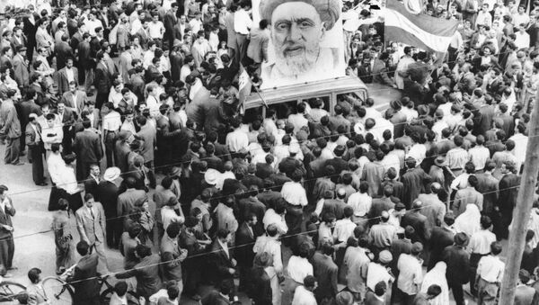 In this Dec. 13, 1951 file photo, crowds of supporters of Prime Minister Mossadegh gather around a huge portrait of Iranian Mullah Kashani, one of the powerful backers of Mossadegh's regime, in Tehran. Once expunged from its official history, documents outlining the U.S.-backed 1953 coup in Iran have been quietly published in June 2017, by the State Department, offering a new glimpse at an operation that ultimately pushed the country toward its 1979 Islamic Revolution and hostility with the West. - Sputnik International