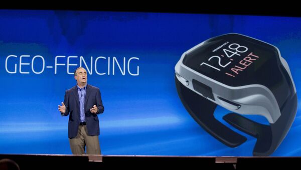 Intel CEO Brian Krzanich talks about geo-fencing in a wearable tracker during a keynote address at the Consumer Electronics Show, Monday, Jan. 6, 2014, in Las Vegas - Sputnik International