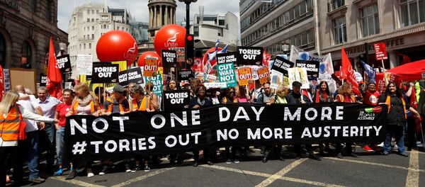 Demonstrators prepare to set off for Parliament Square on an anti-austerity rally and march organised by campaigners Peoples' Assembly, in central London, Britain July 1, 2017 Demonstrators prepare to set off for Parliament Square on an anti-austerity rally and march organised by campaigners Peoples' Assembly, in central London, Britain July 1, 2017 - Sputnik International