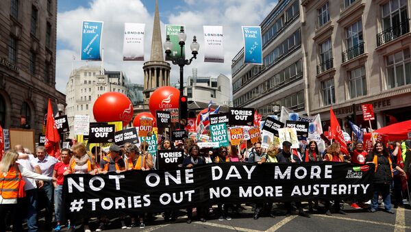 Demonstrators prepare to set off for Parliament Square on an anti-austerity rally and march organised by campaigners Peoples' Assembly, in central London, Britain July 1, 2017 - Sputnik International
