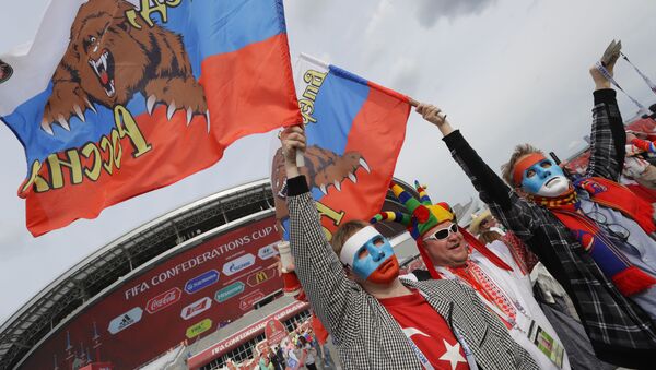 Russian supporter hold flags prior to the Confederations Cup, Group A soccer match between Mexico and Russia, at the Kazan Arena, Russia, Saturday, June 24, 2017. - Sputnik International