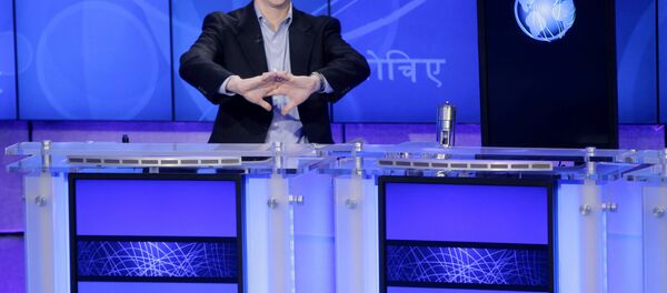 Jeopardy! contestant Ken Jennings, who won a record 74 consecutive games, cracks his knuckles before starting a practice match against another Jeopardy! champion and an IBM computer called Watson in Yorktown Heights, N.Y., Thursday, Jan. 13, 2011. It's the size of 10 refrigerators, and it swallows encyclopedias whole, but an IBM computer was lacking one thing it needed to battle the greatest champions from the Jeopardy! quiz TV show - it couldn't hit a buzzer. - Sputnik International