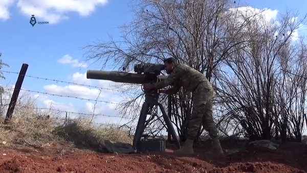 An Army of Glory fighter launches a BGM-71 TOW anti-tank missile at a Syrian government position during the 2017 Hama offensive. - Sputnik International