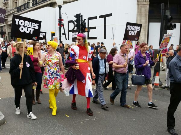 Protesters descended on central London for march against Theresa May on July 1. Protesters descended on central London for march against Theresa May on July 1. - Sputnik International