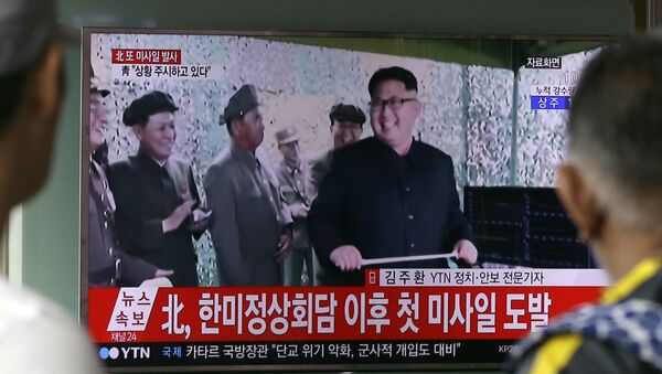 A TV news program shows a file image of North Korean leader Kim Jong Un, at Seoul Railway Station in Seoul, South Korea. in Seoul, South Korea, Tuesday, July 4, 2017. - Sputnik International