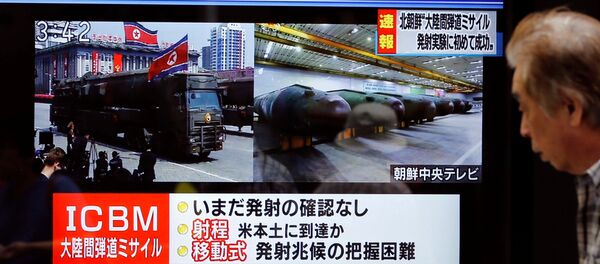 A man walks past a street monitor showing news of North Korea firing a ballistic missile in Tokyo, Japan, July 4, 2017. A man walks past a street monitor showing news of North Korea firing a ballistic missile in Tokyo, Japan, July 4, 2017. - Sputnik International