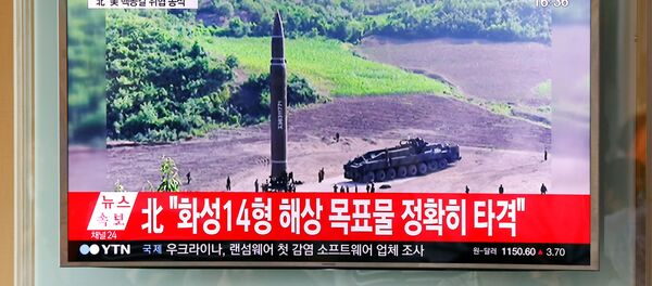 A man watches a TV broadcasting still photographs released by North Korea's state-run television KRT of North Korea's Hwasong-14 missile, a new intercontinental ballistic missile, which they said was successfully tested, at a railway station in Seoul, South Korea, July 4, 2017. A man watches a TV broadcasting still photographs released by North Korea's state-run television KRT of North Korea's Hwasong-14 missile, a new intercontinental ballistic missile, which they said was successfully tested, at a railway station in Seoul, South Korea, July 4, 2017. - Sputnik International