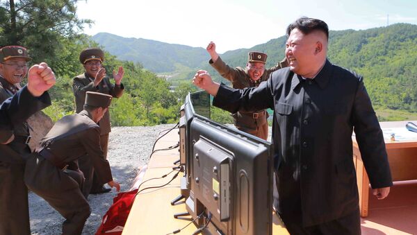 North Korean Leader Kim Jong Un reacts during the test-fire of intercontinental ballistic missile Hwasong-14 in this undated photo released by North Korea's Korean Central News Agency (KCNA) in Pyongyang, July, 4 2017. - Sputnik International